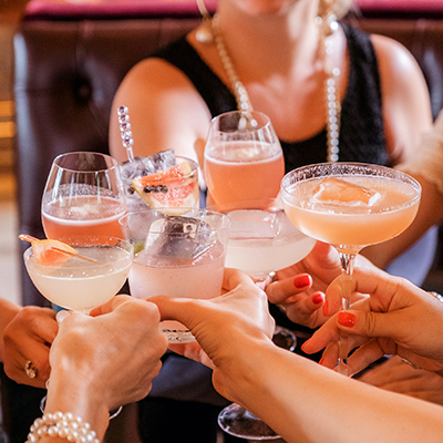 Group of people clashing drinks